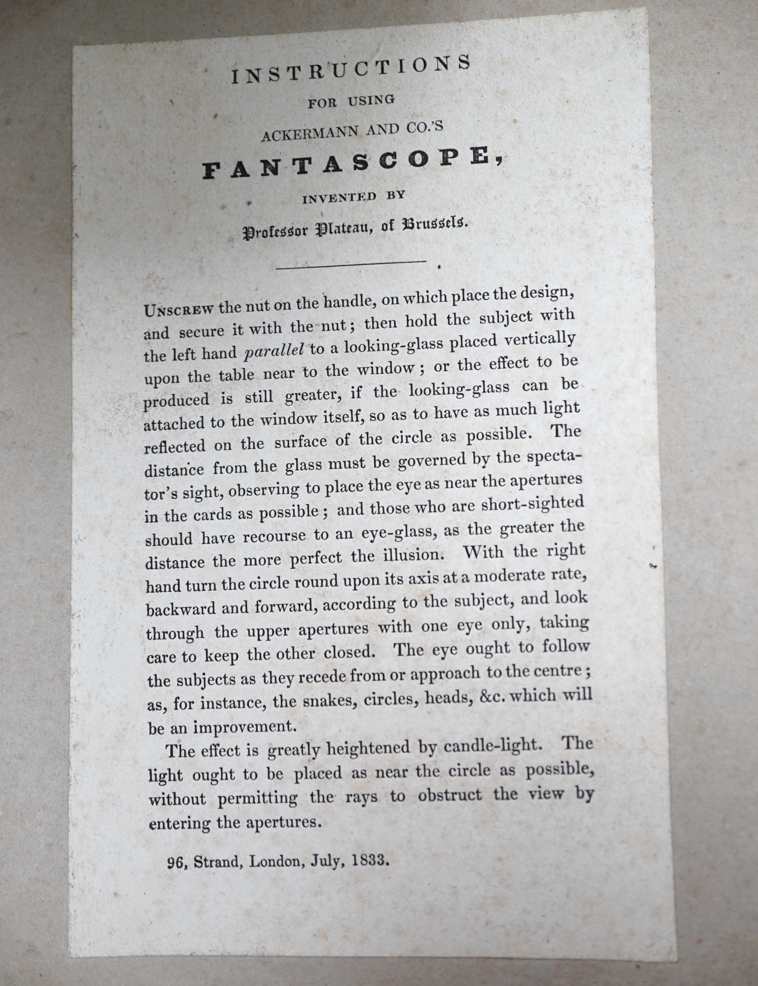 A mid-19th century folder of Fantascope card discs, pub. by Ackermann and Co., (six cards without the viewer). Condition - poor, spine broken and boards detached.